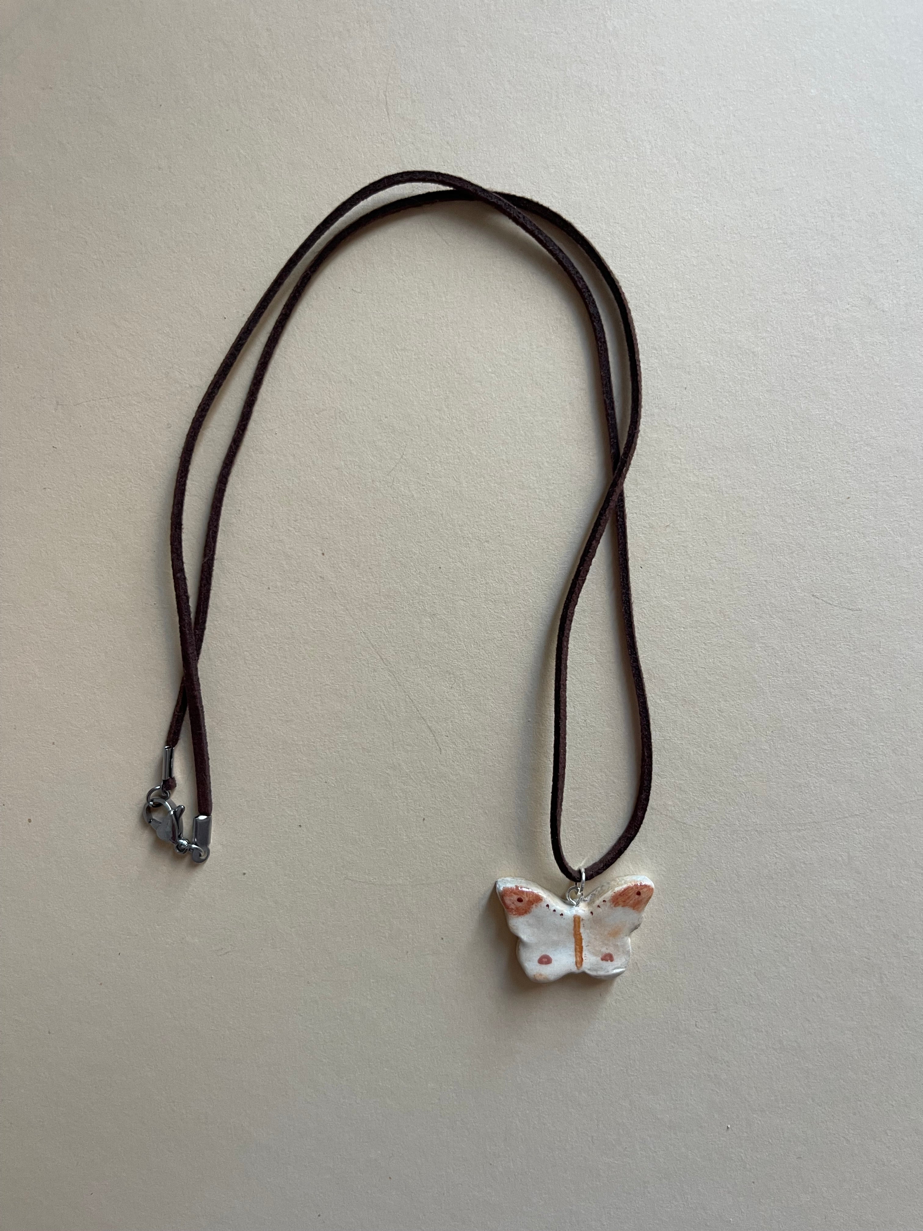 Tonal butterfly on leather