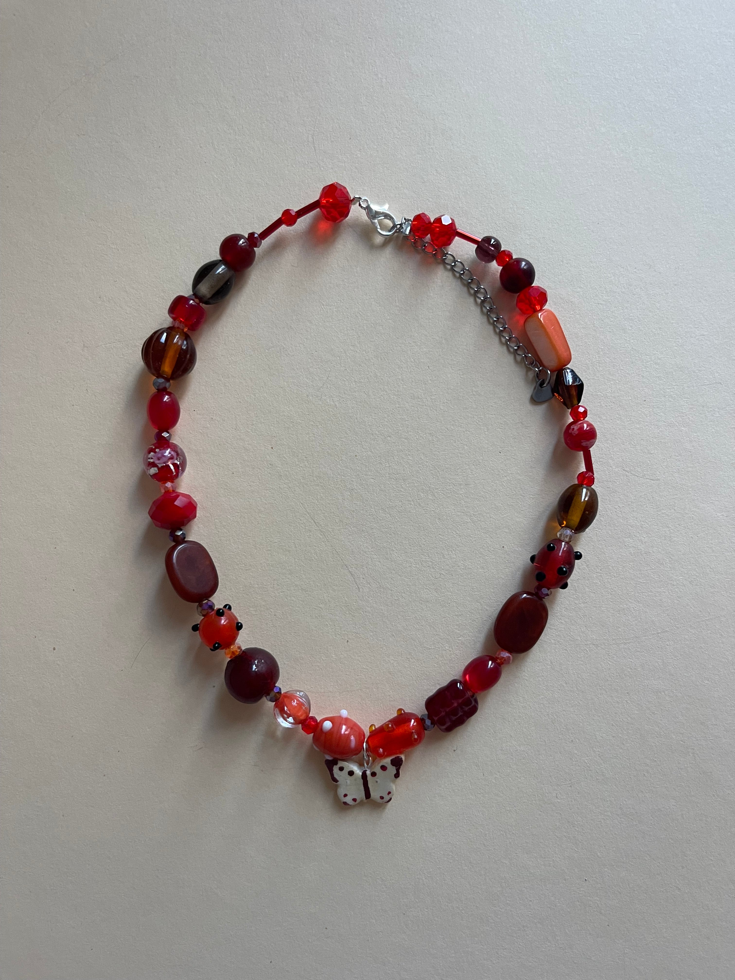 Red/brown tone butterfly necklace