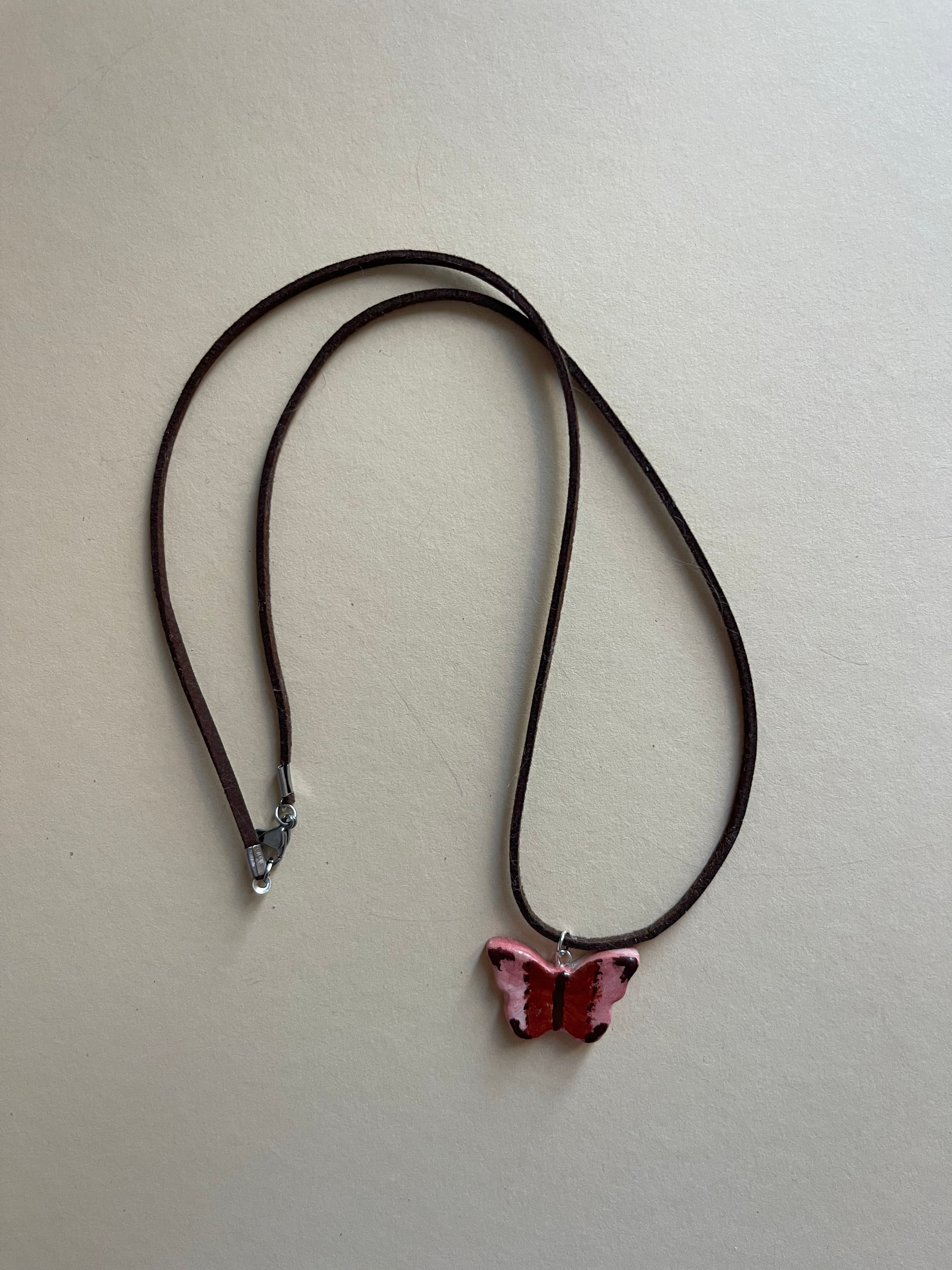 Pink and brown butterfly on leather